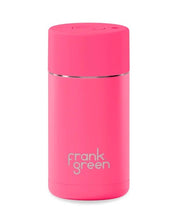Load image into Gallery viewer, A pink Frank Green vacuum insulated travel tumbler with a matching pink lid and a thin silver metallic band, shown on a plain white background.
